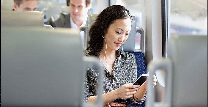 Woman on a bus using her phone