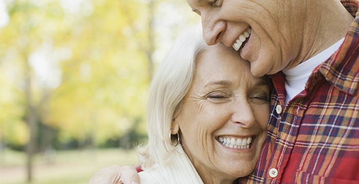 Man and woman hugging and smiling